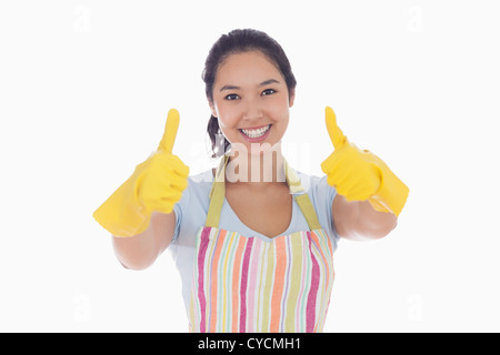 Frau in Gummihandschuhe Daumen aufgeben Stockfoto