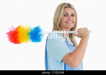 Lächelnd Putzfrau Holding Staubwedel Stockfoto