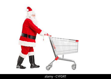 Santa Claus schieben einen leeren Einkaufswagen isoliert auf weißem Hintergrund Stockfoto