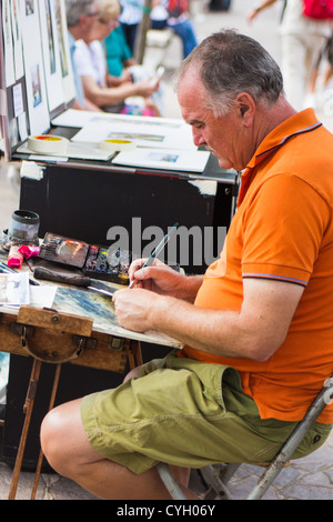 Künstler auf Mann skizziert Kunst, am Wasser in der Nähe des Markusplatzes Venedig Italien Stockfoto