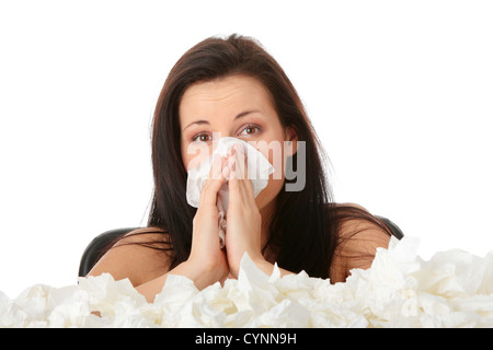 Junge Frau in Menge Gewebe um Stockfoto