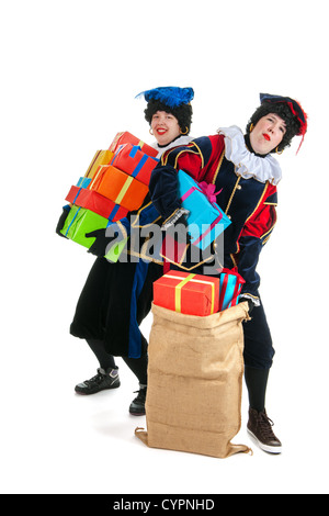 Niederländische Zeichen als weiße Petes für typische Sinterklaas Urlaub mit Jute-Taschen Stockfoto