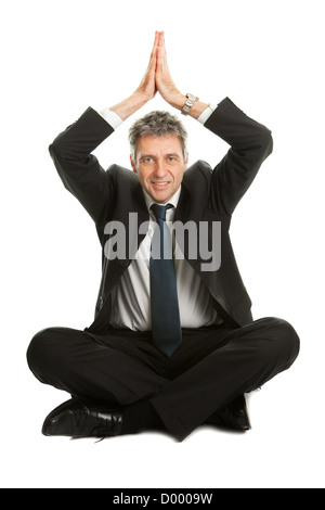 Unternehmer im Yoga Position sitzen Stockfoto