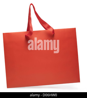 Seitlicher Blick auf eine rote Einkaufstasche in Bewegung. Clipping-Pfad Stockfoto