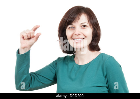 Schöne Frau, die kleine Sache Geste vor einem weißen Hintergrund Stockfoto