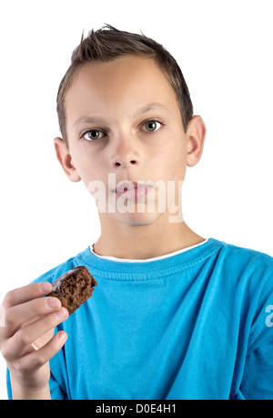 Junge, ein Muffin zum Anbeißen Stockfoto