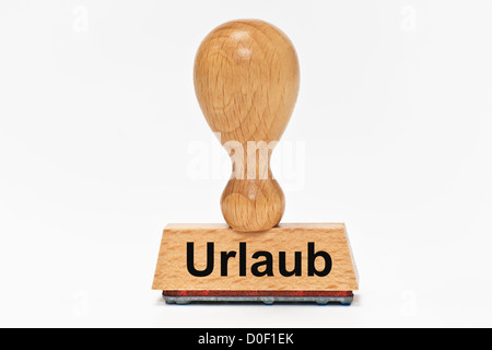 Ein Stempel mit der deutschen Aufschrift Urlaub (Ferien) aufrecht, Hintergrund weiß. Stockfoto