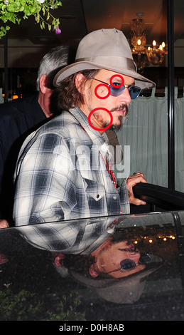 Johnny Depp trägt ein Fedora-Hut und Sonnenbrille fährt um C London Restaurant mit Schnitten und blauen Flecken im Gesicht London, England Stockfoto