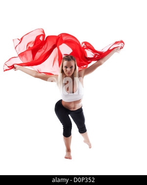 Frau in Yoga-Pose und gelb Stoff fliegen Stockfoto