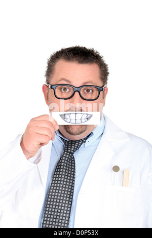 Männliche Zahnarzt hält Bild der Zähne Stockfoto