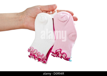 Baby Socken in Frauenhand abzuschließen. Stockfoto