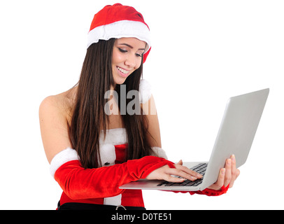 Isolierte junge Weihnachtsmädchen mit Laptop Stockfoto