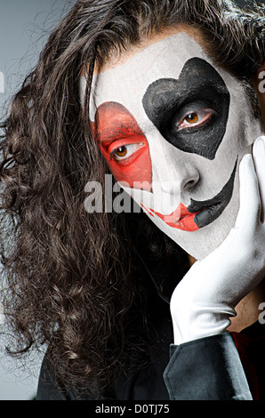 Joker mit Gesichtsmaske im studio Stockfoto