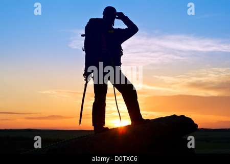 Silhouette-Kletterer Stockfoto