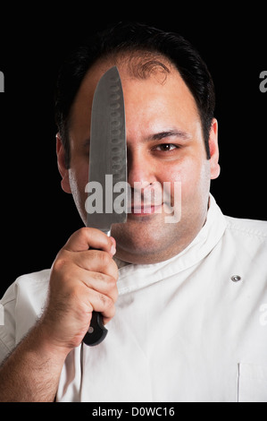 Porträt eines Kochs mit einem Messer Stockfoto