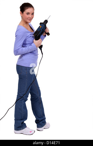 Frau mit einer Schraube-Pistole Stockfoto