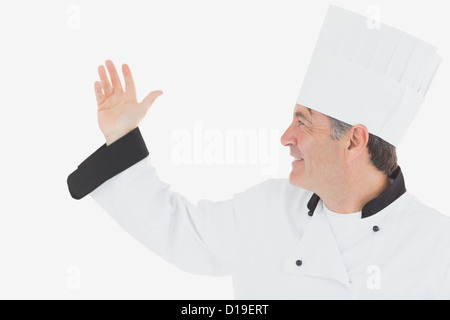 Glücklich Reife Chef in einheitlichen gestikulieren Stockfoto