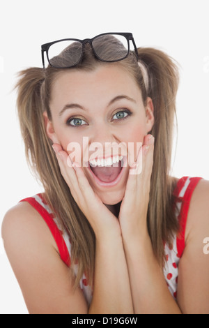 Überrascht, junge Frau mit den Händen auf Gesicht Stockfoto