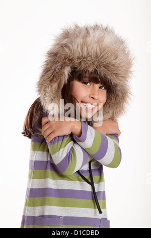 glückliches Kind posiert in einem weißen Hintergrund studio Stockfoto