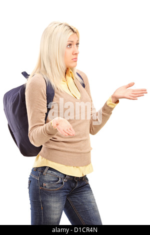 Eine blonde Studentin mit Rucksack gestikulieren - ich weiß es nicht Stockfoto