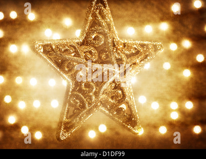 Foto der schönen goldenen Sterne Dekorationen auf blur, Hintergrund, abstrakt gold Hintergrund, Weihnachtszeit Ornament, traditionellen Xmas Stockfoto