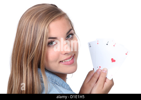 Junge Frau Holding vier Asse Stockfoto