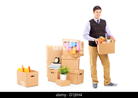 In voller Länge Portrait von einem jungen männlichen und bewegende Boxen isoliert auf weißem Hintergrund Stockfoto