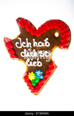 Lebkuchenherz, gebissen, Symbol für fertige Liebe, Beziehung. Sagen, ich liebe dich in deutscher Sprache. Stockfoto