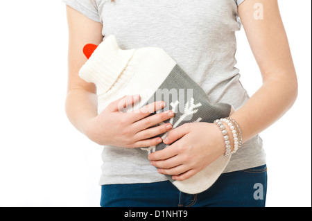 Junges Mädchen hat Schmerzen im Unterleib, isoliert auf weiss Stockfoto