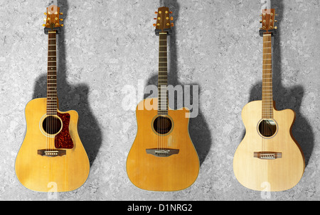 3 klassische Gitarren hängen an einer Holzwand Stockfoto