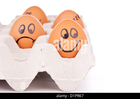 Eiern mit menschlichen Eigenschaften isoliert auf weiss als Konzept Stockfoto