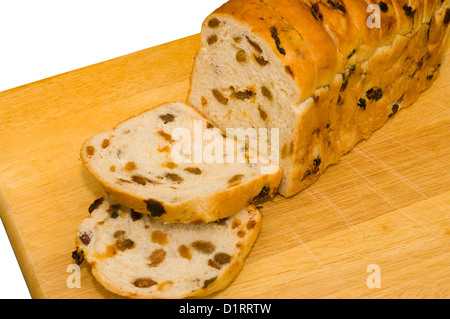 In Scheiben geschnitten Obst Laib auf ein Schneidbrett aus Holz Stockfoto