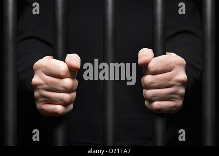 Gefangen hinter Gittern. Hautnah. Stockfoto