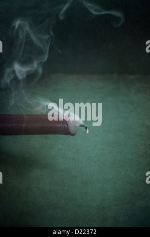 Erloschener rote Kerze Stockfoto