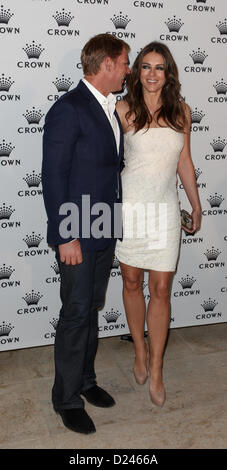 Shane Warne und Liz Hurley an der IMG Tennis Spieler Party, Krone, Melbourne, 13. Januar 2013. Stockfoto