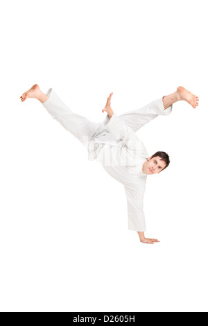 Ein Junge Karate-Mann Durchführung isolierten auf weißen Hintergrund Stockfoto