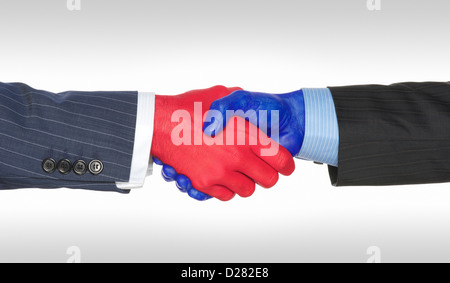 Handshake zwischen zwei Männer. Handshake bezeichnet die kreative Konzept der republikanischen und demokratischen politischen Parteien zustimmen. Stockfoto