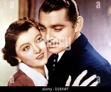 Seine Sekretaerin Frau Versus Sekretär Myrna Loy, Clark Gable plausibler Sieht Stanhopes (Clark Gable) Frau Linda (Myrna Loy) Stockfoto