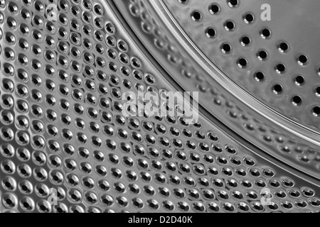 Glänzende Metall Innenleben einer Waschmaschine Trommel einen generische Hintergrund erstellen Stockfoto