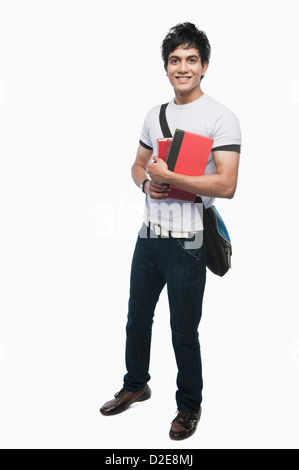 Porträt von ein College-Student hält Notizbücher Stockfoto