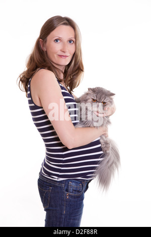 Schwangere Frau mit Perserkatze Stockfoto