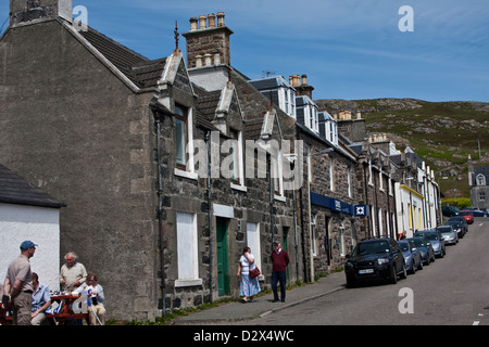 Steinhäuser Linie der Hauptstraße von Castlebay auf der Isle of Barra, äußeren Hebriden, Western Isles, Schottland Stockfoto