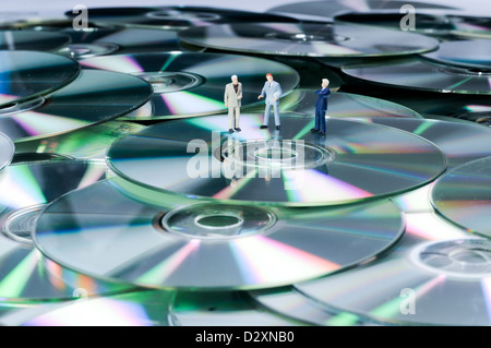 Unternehmer Zahlen auf DVDs Stockfoto