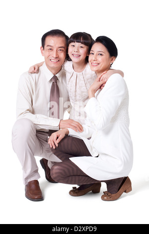 Porträt der fröhlichen Familie hocken Stockfoto