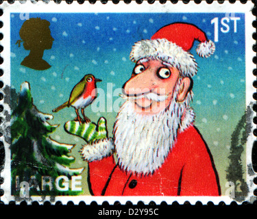 Vereinigtes Königreich - ca. 2012: Eine Briefmarke gedruckt in Großbritannien gewidmet Weihnachten, zeigt Santa Claus mit Vogel, ca. 2012 Stockfoto