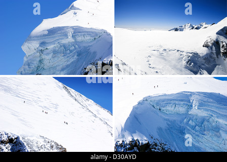 Bergsteiger-Team in hohen Winterberge Klettern an einem klaren sonnigen Tag mit Schnee bedeckt. Stockfoto