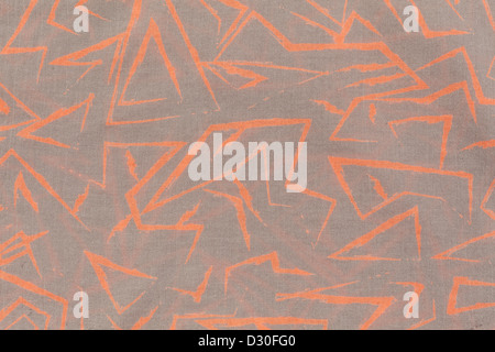 Hochauflösende Textur von beiger Stoff mit abstrakten Mustern der orangenen Linien Stockfoto