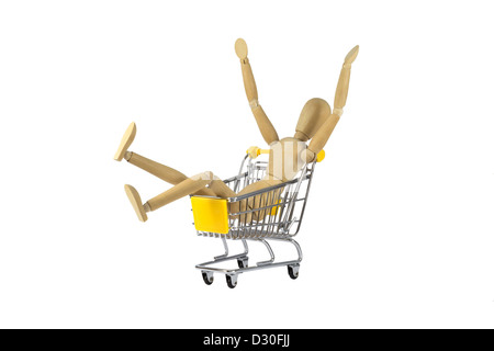 Eine glückliche weibliche Holzpuppe in einem Warenkorb Stockfoto