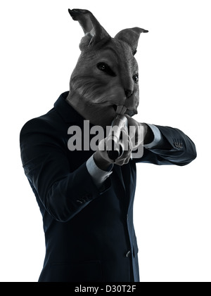 ein Mann Maske Kaninchenjagd mit Schrotflinte Porträt im Silhouette Studio isoliert auf weißem Hintergrund Stockfoto