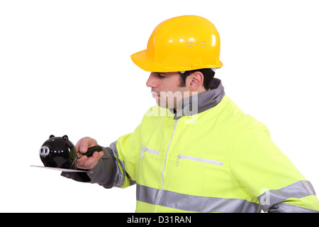 Mason Ausgleich Sparschwein auf Kelle Stockfoto